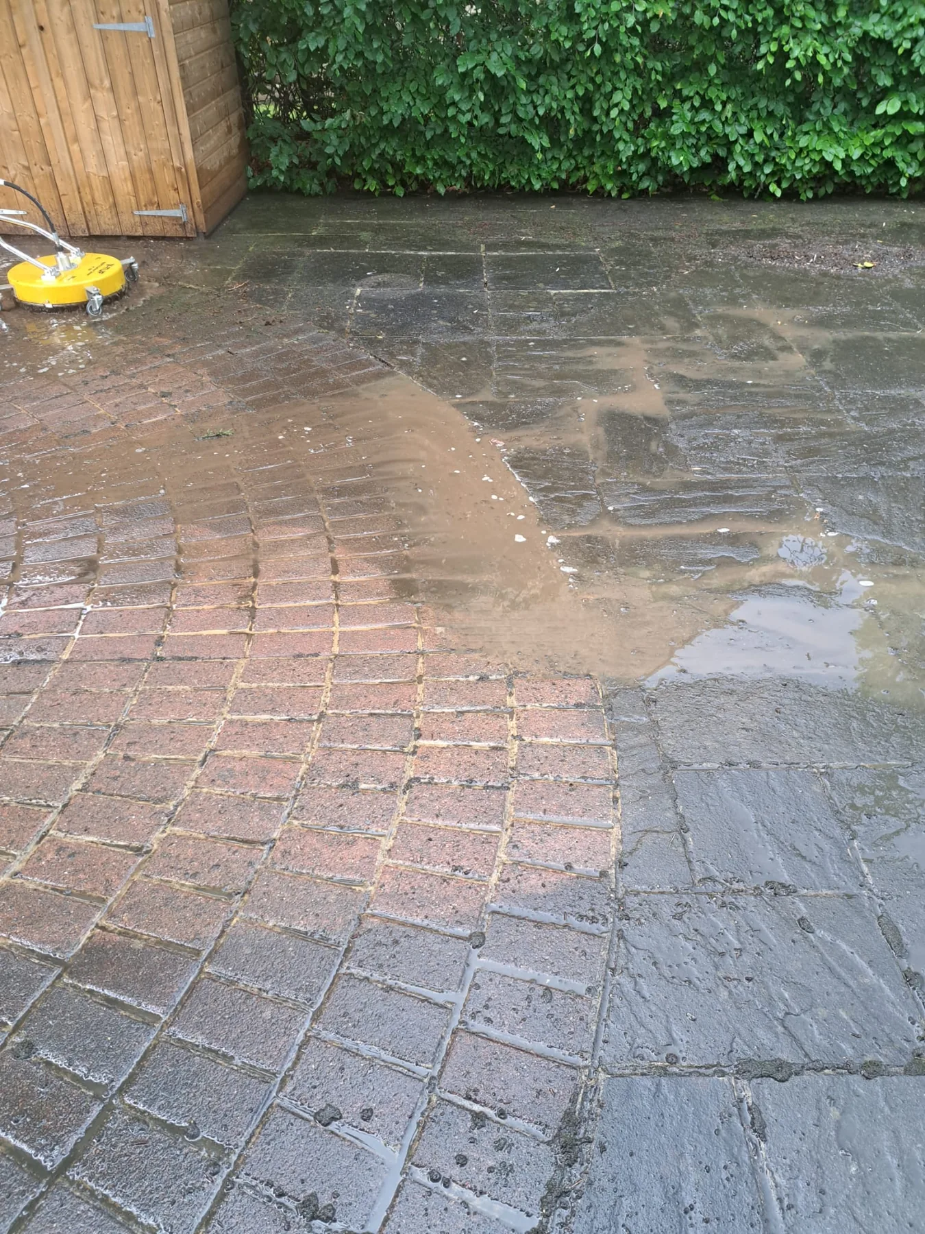 Pressure washing in progress close-up