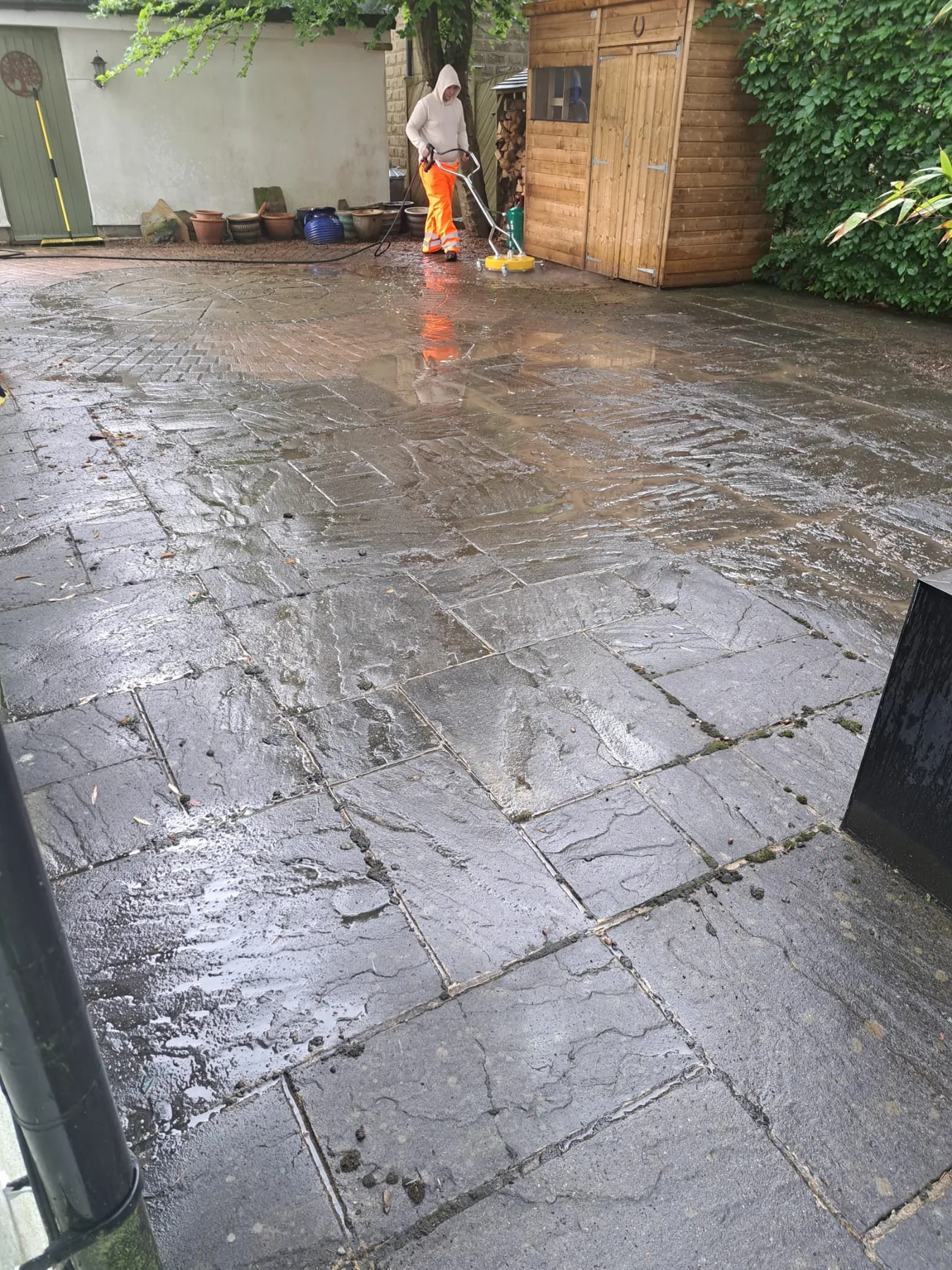 Surface cleaner being used on paving